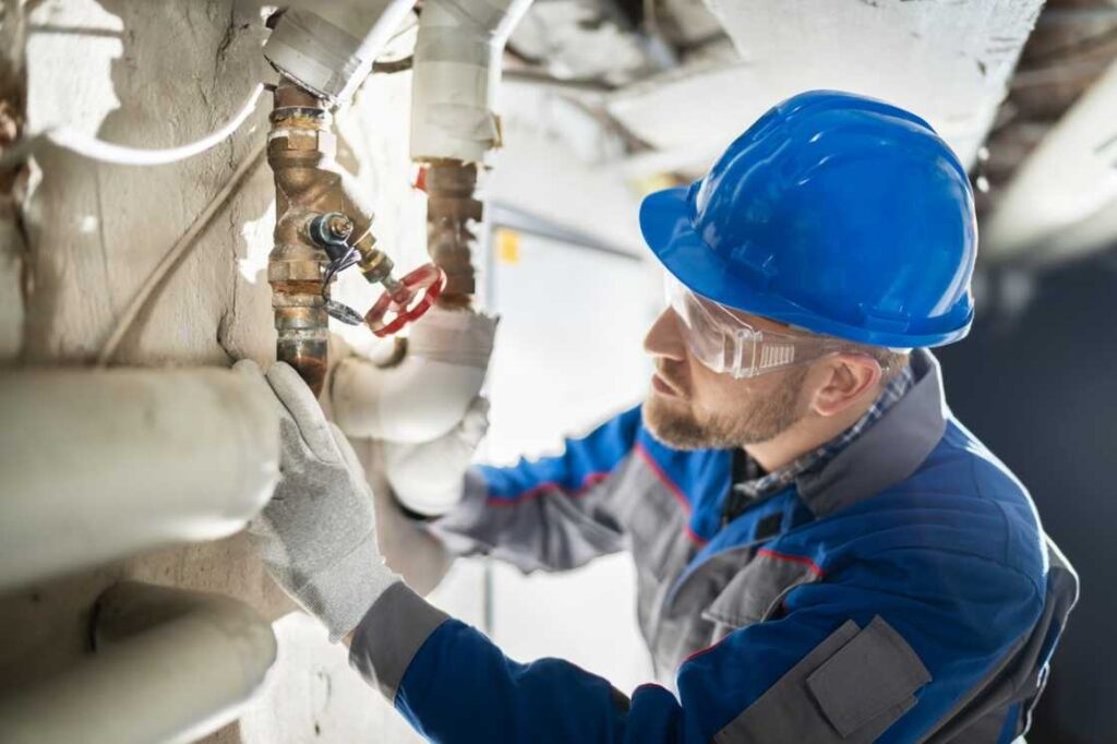 Parobek plumber inspecting a water shut off valve