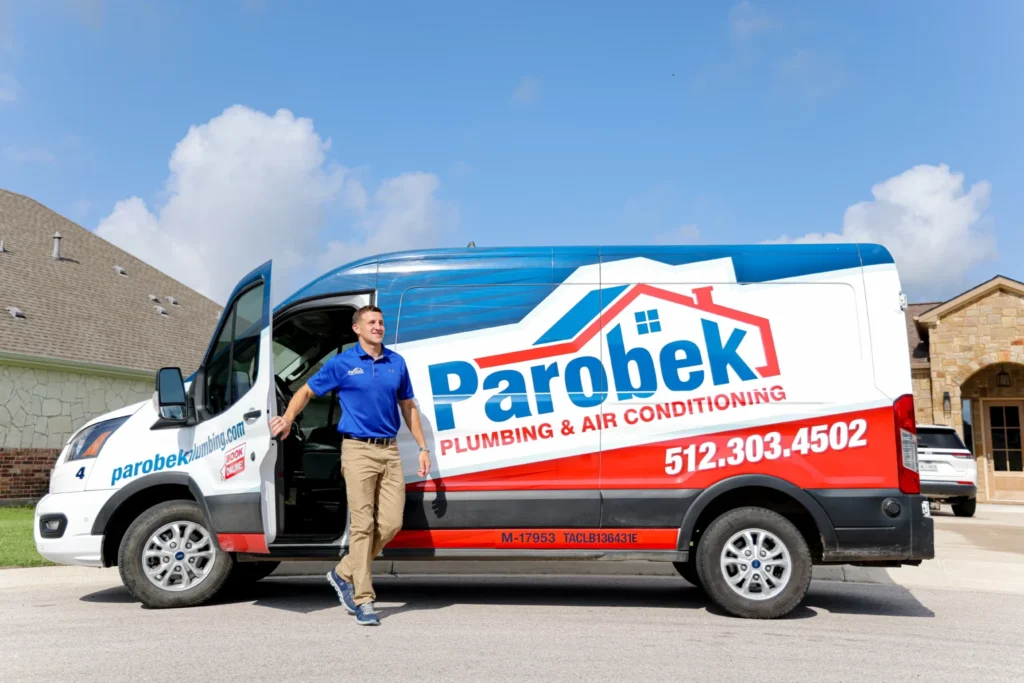 Parobek plumber getting out of van