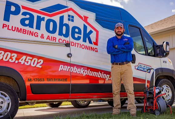 Man standing in front of a Parobek truck