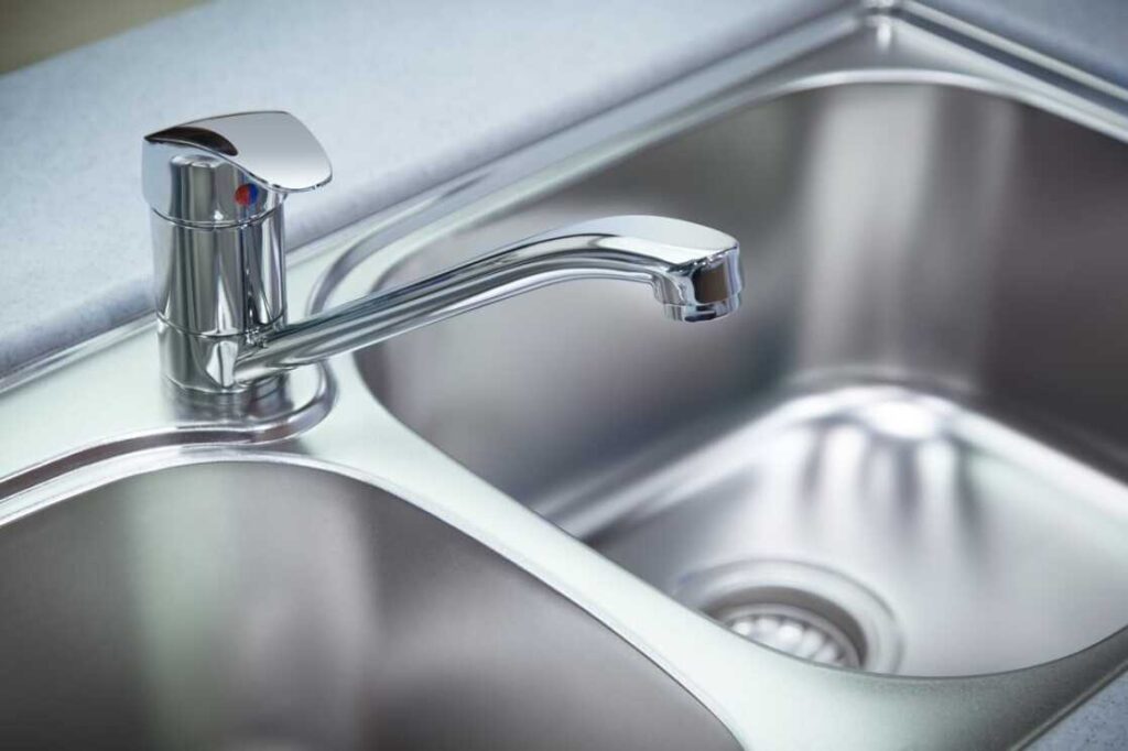 Stainless steel sink with faucet