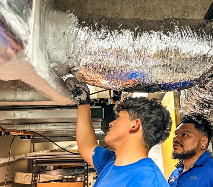 Workers installing HVAC