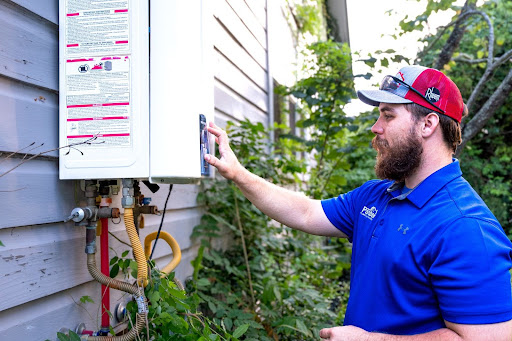 Parobek Tech working on a tankless water heater