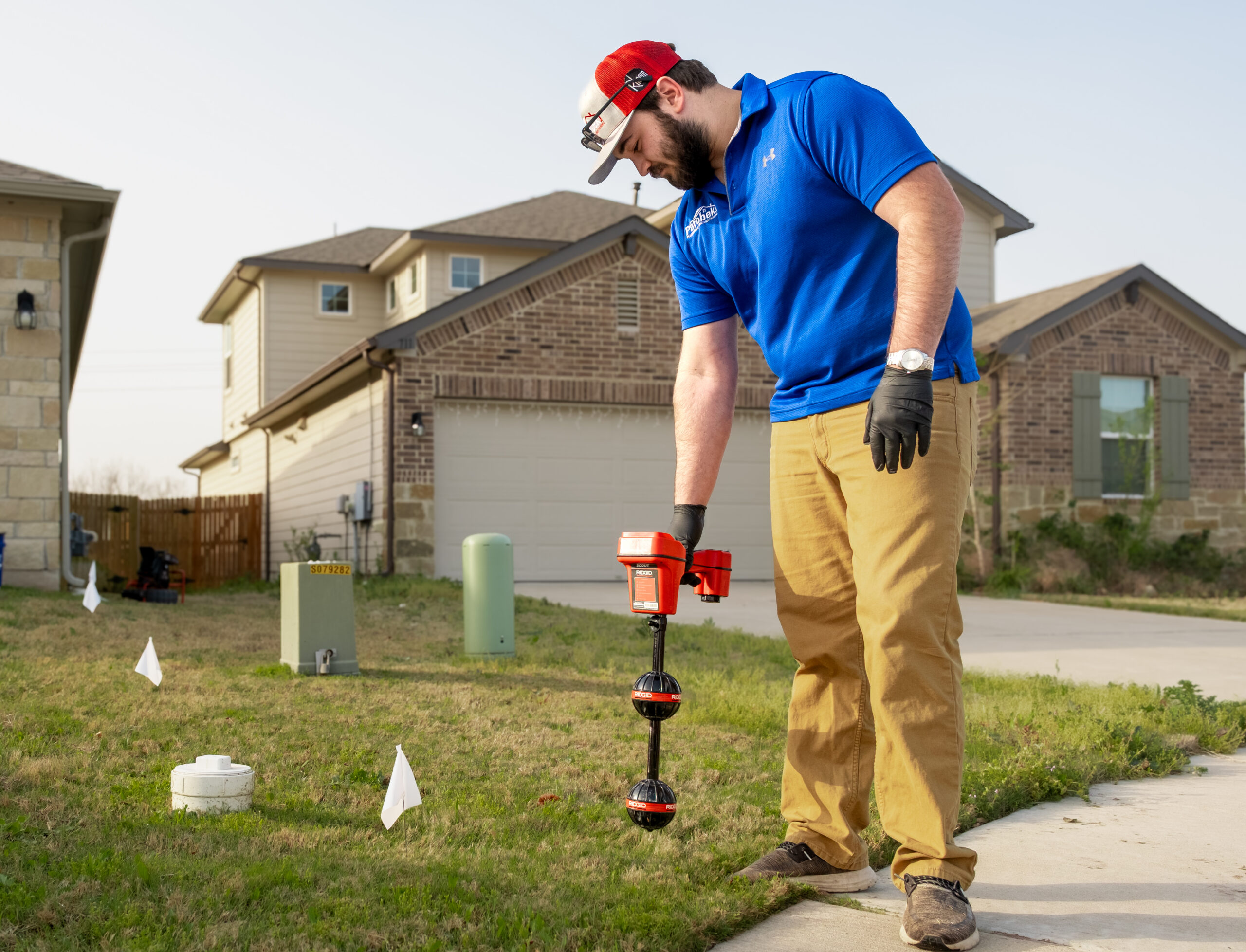 Man testing for leaks in lawn