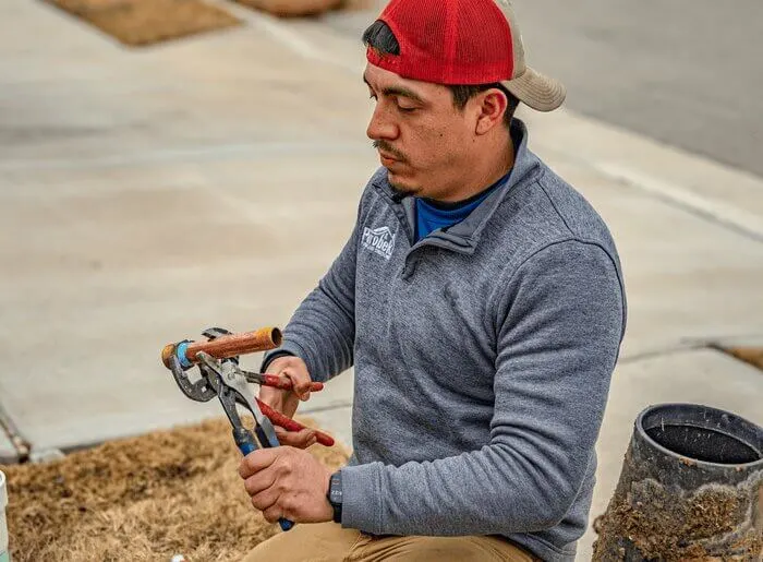 Man working on repiping a house