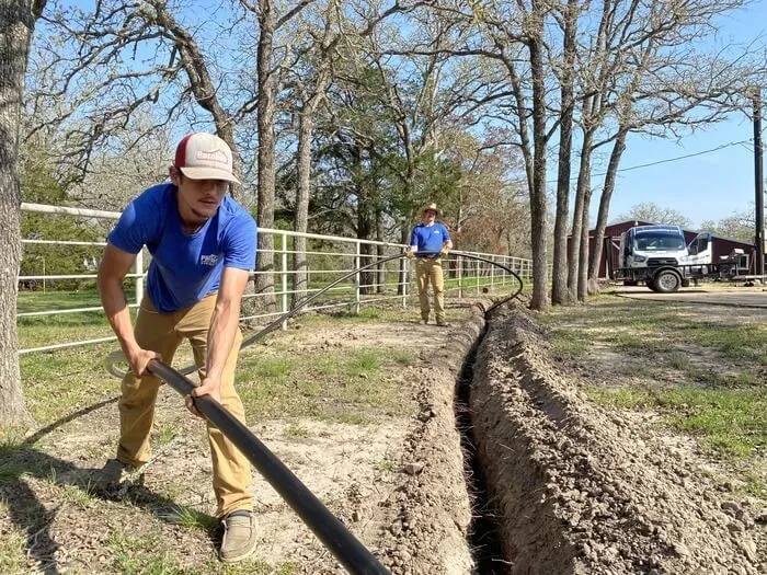 Parobek technician trenching main water line